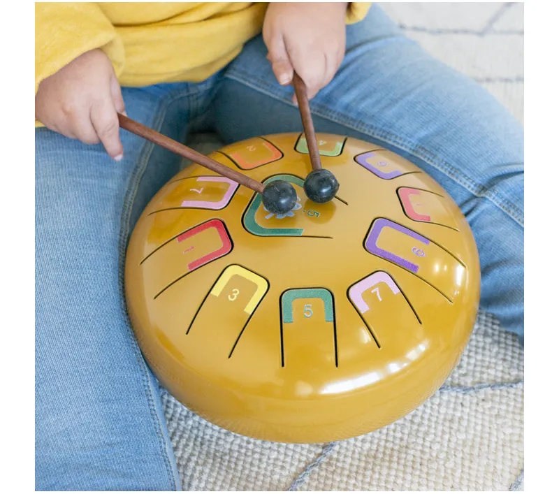 Tambu by Juegaconmigo is a steel tongue drum for children. Play with hands, fingers or sticks