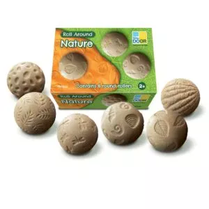 Yellow door roll around nature are sensory stones with stamp imprints, use them for creative play in the sand
