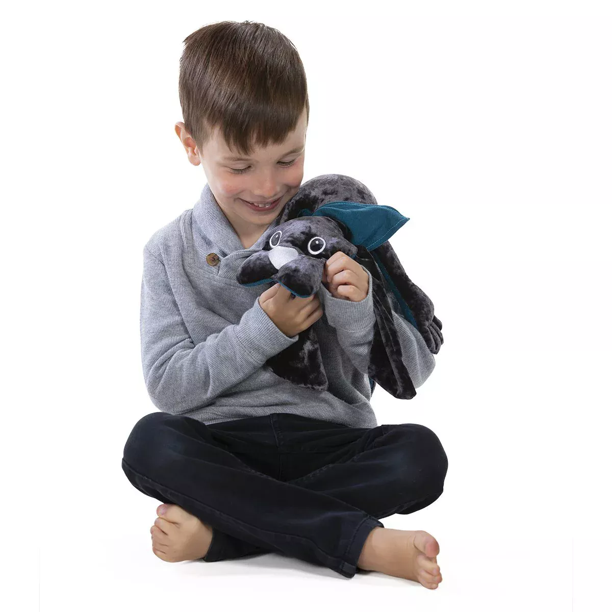 de verzwaringsknuffel hond van manimo helpt kinderen met autisme of adhd om zich geborgen en veilig voelen