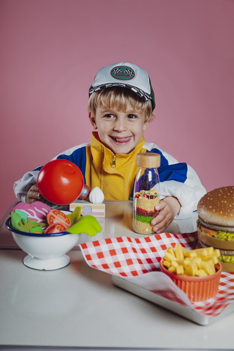 Petit Boum Learning Bottle Mac challenges children to explore and learn about fast food eating