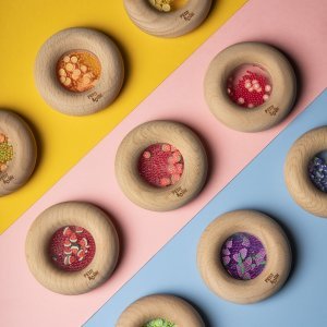 This sensory donut from Petit Boum is beautiful. The wooden teether / rattle are suitable for young children and children with disabilities.
